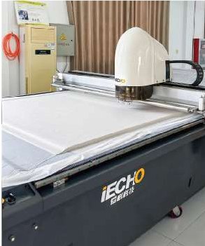 Automated fabric cutting table